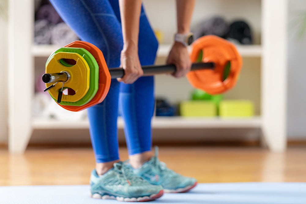 a person with a barbel lifting weights